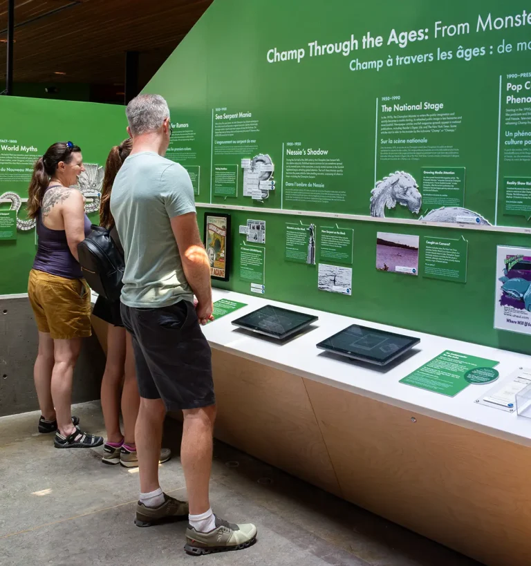 Touch screen games running on touchscreens integrated into a timeline of Champ's folklore.