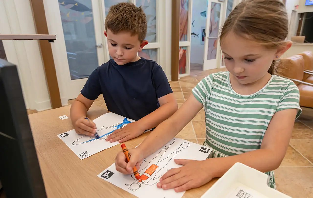 Kids coloring fish for the virtual aquarium