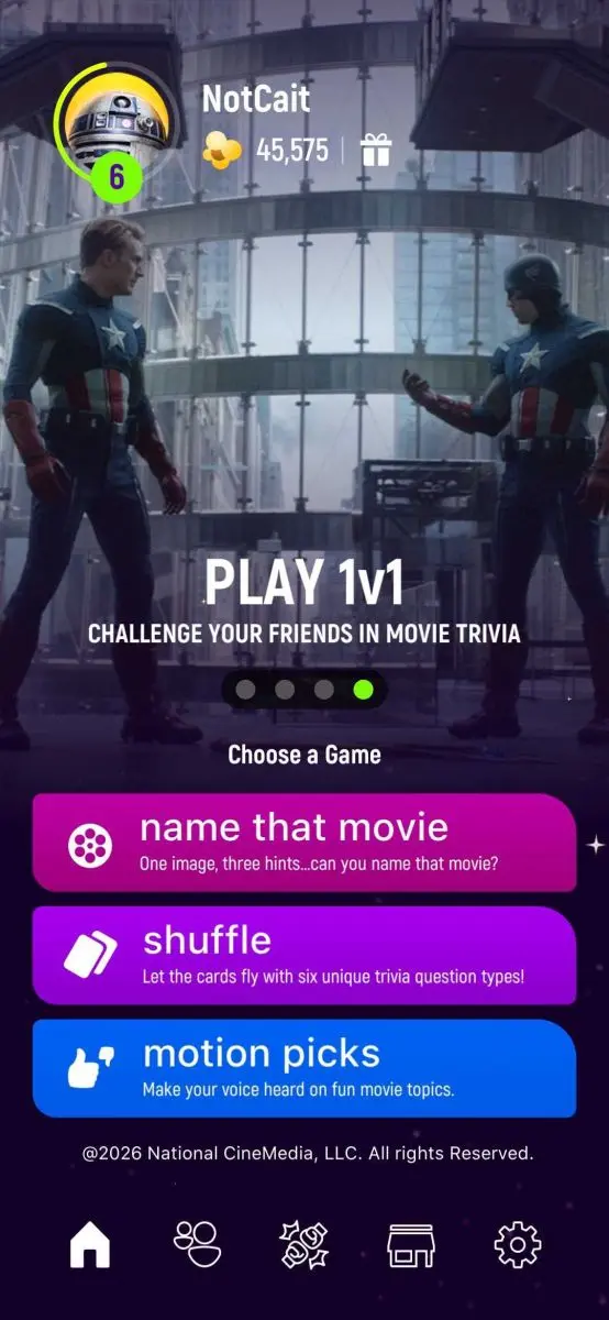 Two action heroes standing apart with a 'Play 1v1' graphic with buttons that say 'name that movie', 'shuffle', and 'motion picks'.